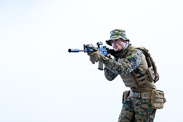 Image showing soldier in action aiming laseer sight optics