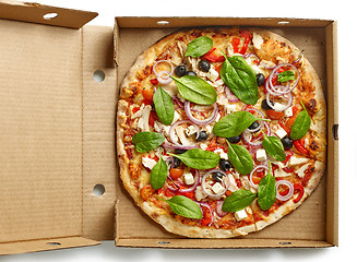 Image showing freshly baked pizza in paper box