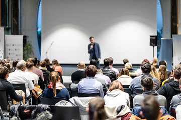 Image showing Business speaker giving a talk at business conference event.