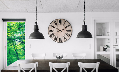 Image showing Retro clock over a table