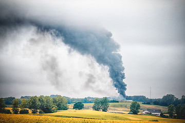 Image showing Black smoke from a fire in a rural countryside