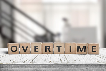 Image showing Overtime word spelled with wooden blocks