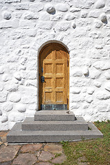 Image showing Wooden door with a stairway on an old building