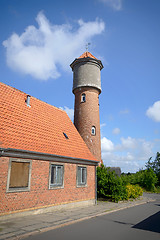 Image showing Tower on a city street made of red bricks