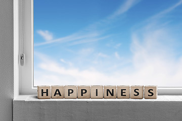 Image showing Happiness sign in a window sill