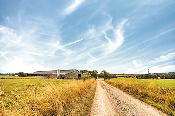 Image showing Farm house near a road in a rural countryside