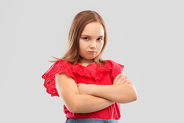 Image showing displeased girl with crossed arms pouting