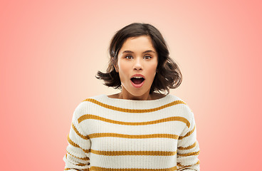 Image showing surprised young woman in striped pullover