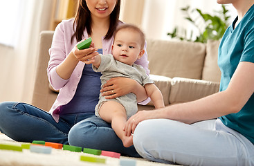 Image showing happy family with baby boy playing at home