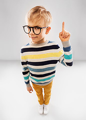 Image showing smiling boy in glasses and striped pullover