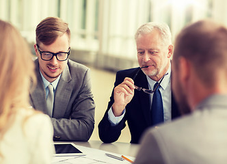 Image showing architects with tablet pc and blueprint at office