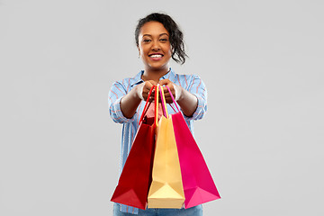 Image showing happy african american woman with shopping bags