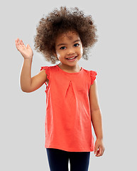 Image showing happy little african american girl waving hand