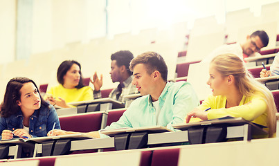 Image showing group of students with notebooks in lecture hall