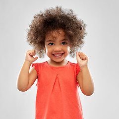 Image showing happy little african american girl over grey