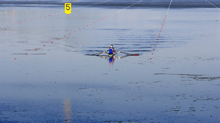 Image showing Two man in a sports boat rowing on the lake