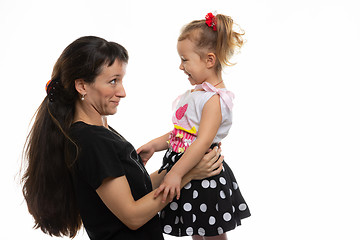 Image showing Mom and four-year-old daughter look at each other with fun