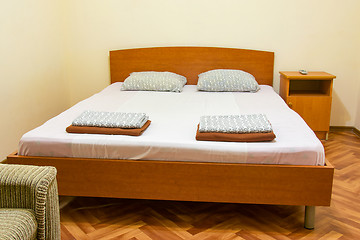 Image showing A double bed in the interior of the guest house