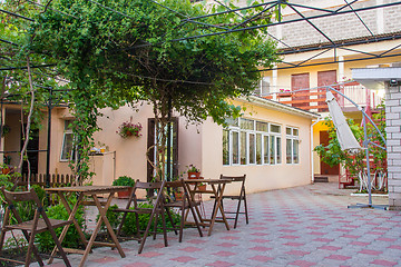 Image showing The courtyard space of a small private hotel, a common plan