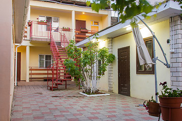 Image showing The exterior of the courtyard of a small guest house