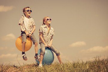 Image showing Brother and sister playing on the field