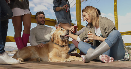 Image showing Group of friends having fun on autumn day at beach