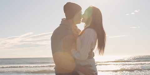 Image showing Couple having fun on beautiful autumn day at beach