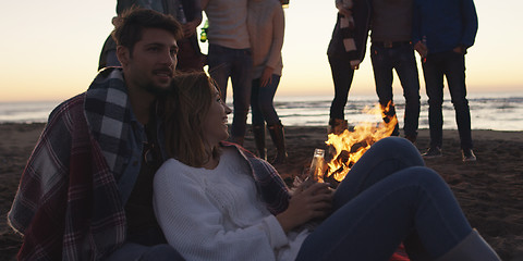 Image showing Friends having fun at beach on autumn day