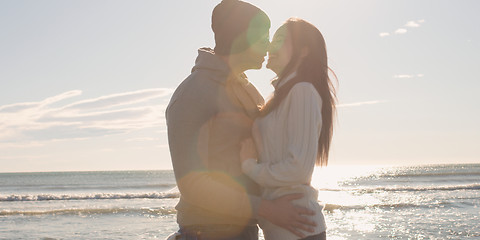 Image showing Couple having fun on beautiful autumn day at beach