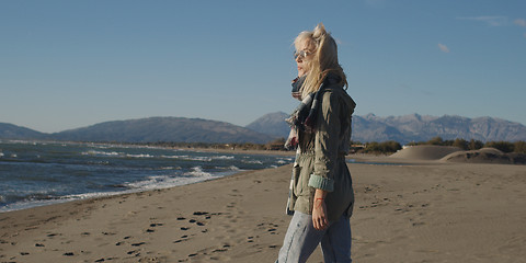 Image showing Young woman enjoying the warm autumn day