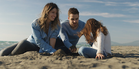 Image showing Young family enjoying vecation during autumn