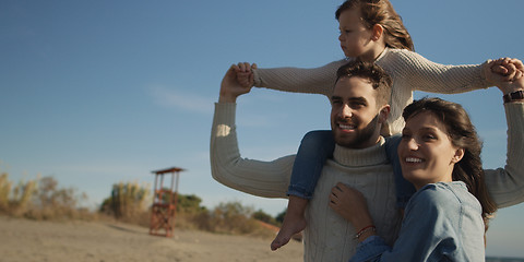 Image showing Young family enjoying vecation during autumn