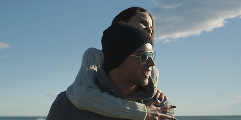 Image showing couple having fun at beach during autumn