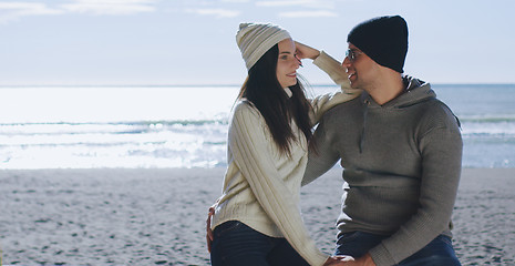 Image showing Couple having fun on beautiful autumn day at beach