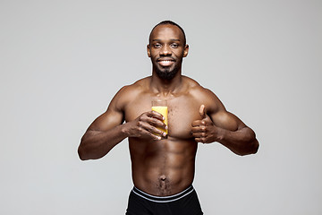 Image showing Fit young man with beautiful torso isolated on gray background