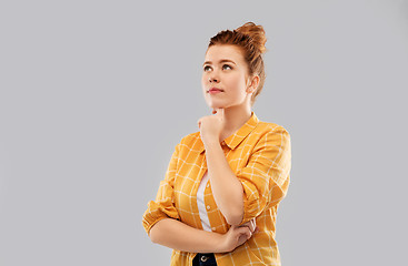 Image showing red haired teenage girl in checkered shirt