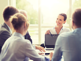 Image showing business people with laptop meeting in office