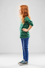 Image showing smiling red haired girl posing in striped shirt