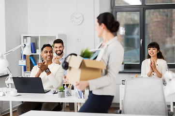 Image showing colleagues applauding to female office worker