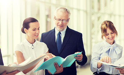 Image showing business team with folders meeting at office