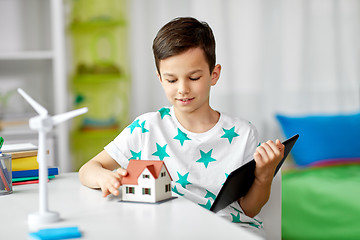 Image showing boy with tablet, toy house and wind turbine