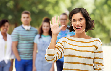 Image showing happy smiling woman showing five fingers