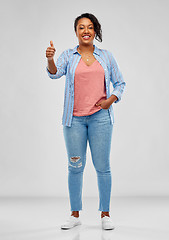 Image showing happy african american woman showing thumbs up