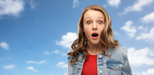 Image showing surprised or shocked teenage girl over sky