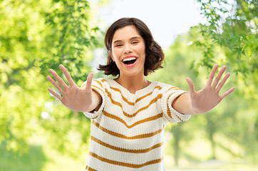 Image showing happy woman showing ten fingers of two hands