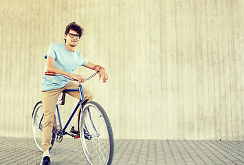 Image showing young hipster man riding fixed gear bike