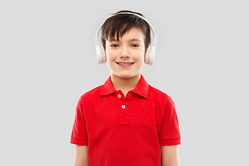 Image showing smiling boy in headphones listening to music