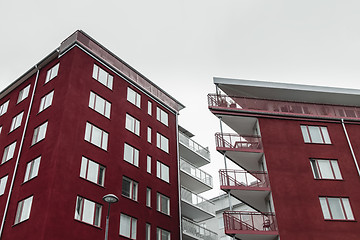 Image showing Corners of modern dark red buildings