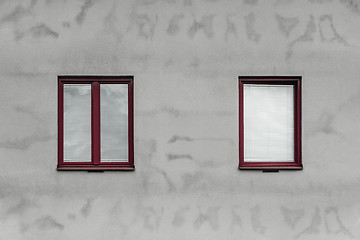 Image showing Red windows and gray wall of a house