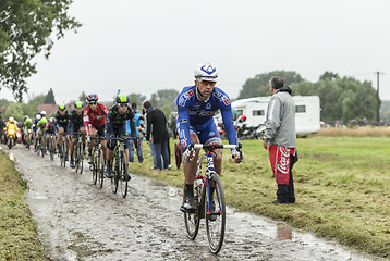 Image showing The Cyclist William Bonnet on a Cobblestone Road - Tour de Franc